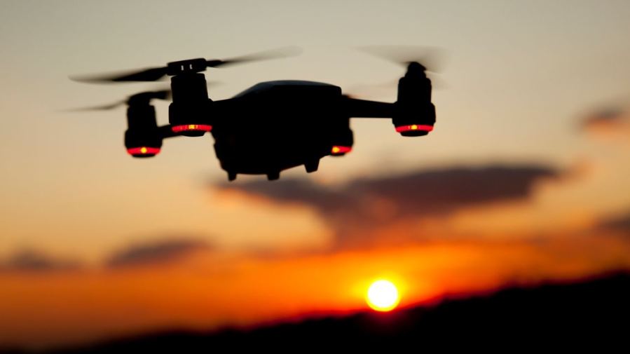 Captivating drone silhouette set against a warm Istanbul sunset sky.