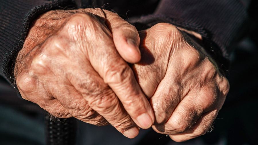 Detailed image of senior hands conveying life experience and wisdom.