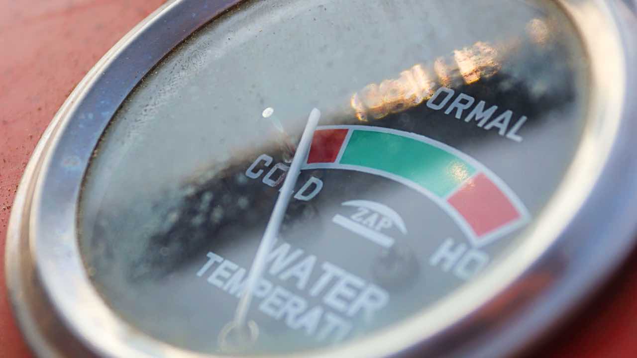 Detailed image of a vintage water temperature gauge showing cold, normal, and hot ranges.