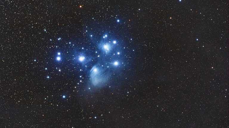 Captivating image of the Pleiades star cluster illuminating the night sky with a stunning cosmic display.
